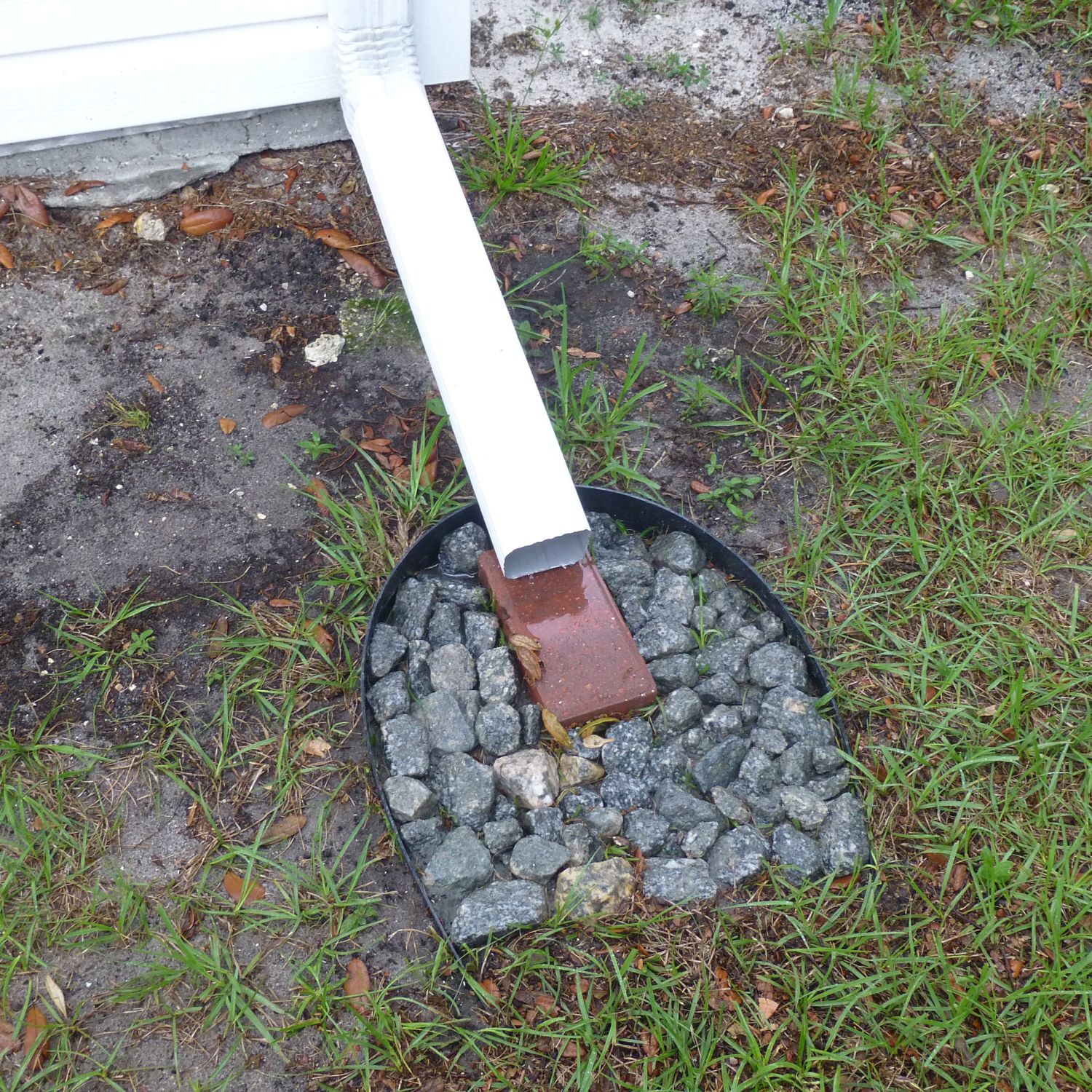Proper downspout drainage for a house
