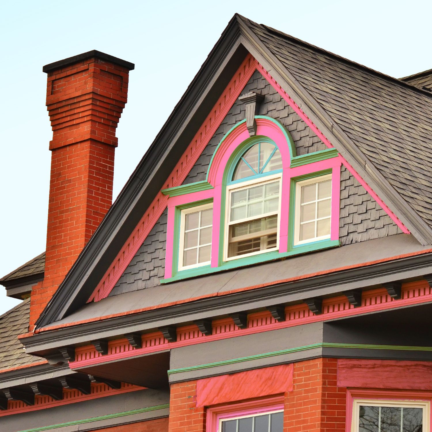 Brand new roof on house with pink and green detailing