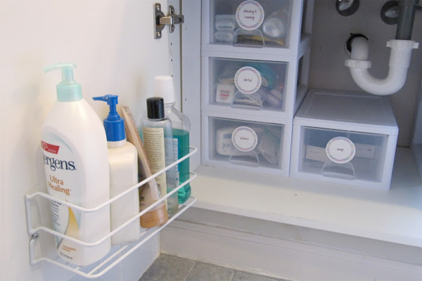 under sink roll outs maximize your cabinet space. www.helpyourshelves.com   Under sink organization bathroom, Bathroom cabinet organization, Diy  bathroom