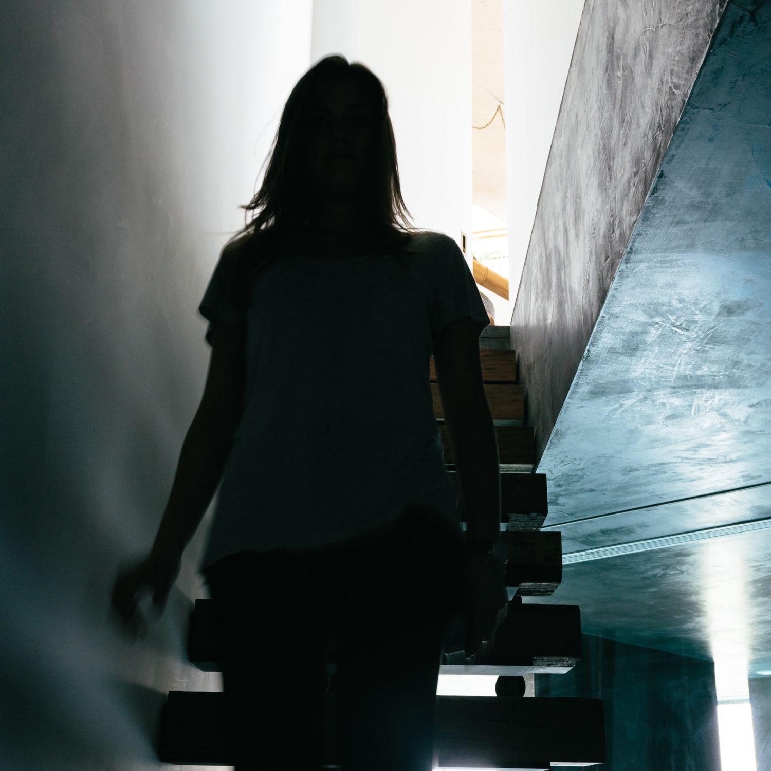 Woman walking up the basement stairs