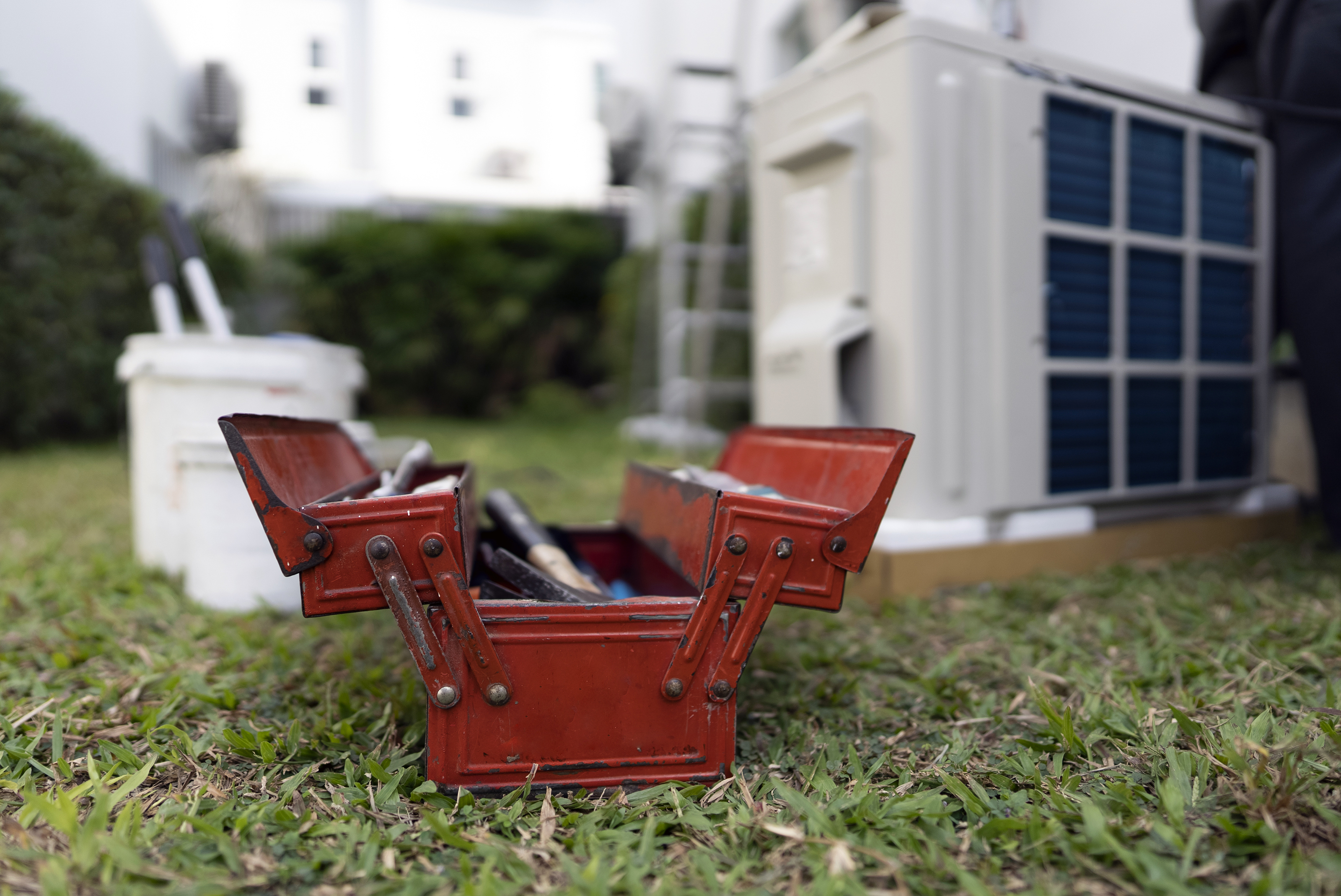 https://www.houselogic.com/wp-content/uploads/2022/08/repair-replace-is-it-time-vintage-red-metal-toolbox-on-grass-in-front-of-broken-air-conditioner.jpg