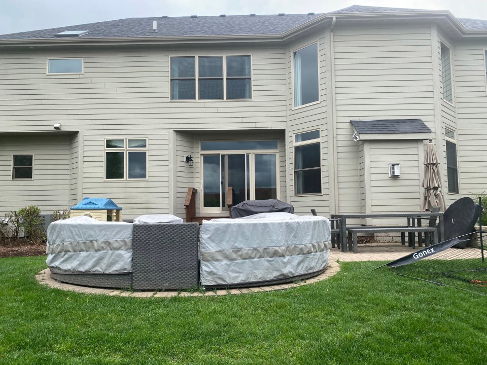 Backyard view of a residential home with no privacy.