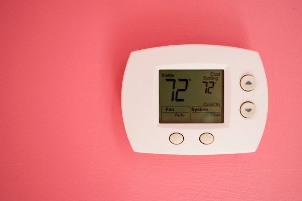 Programmable wall thermostat at 72 degrees Fahrenheit.