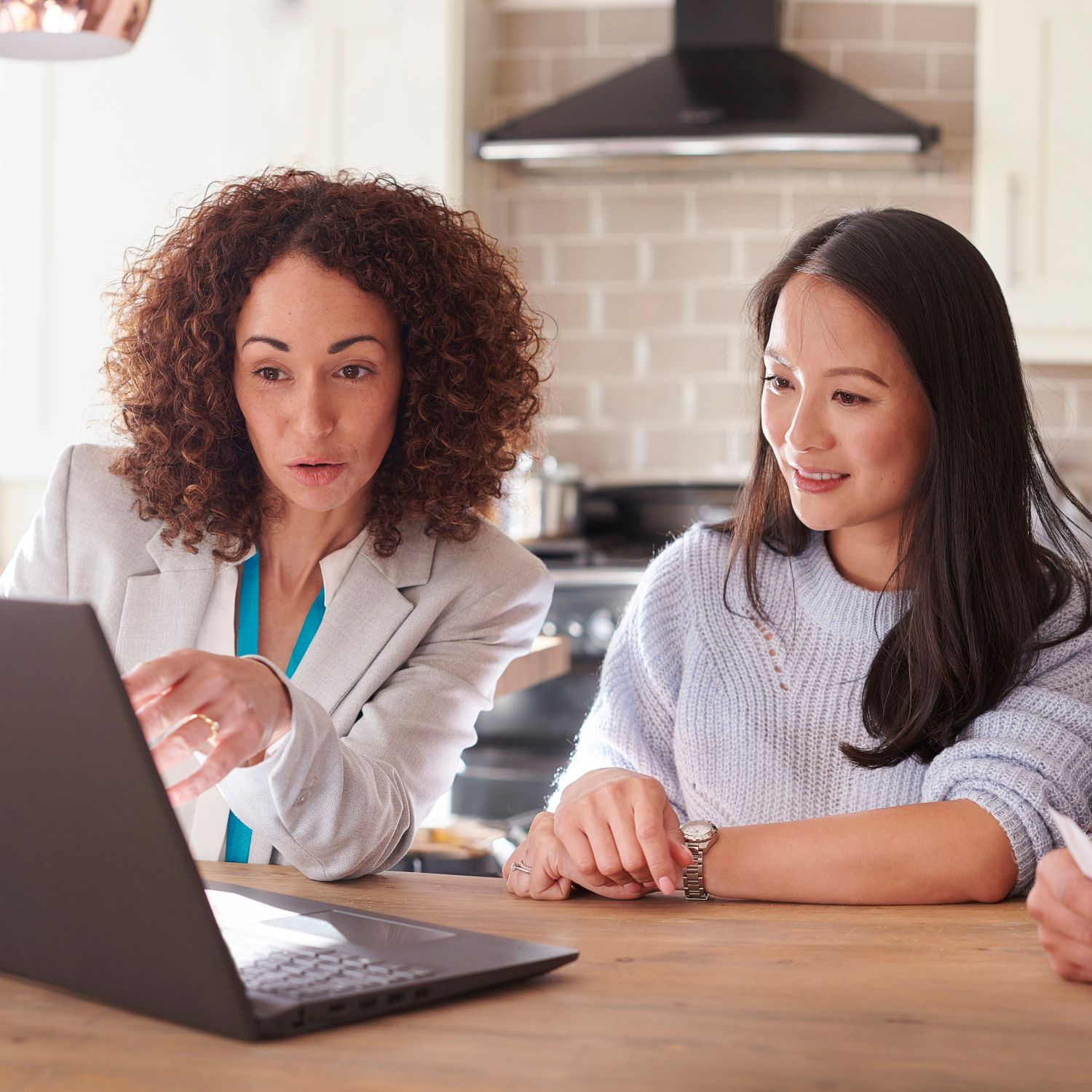 A couple looking to be buy a home following along with their REALTOR®