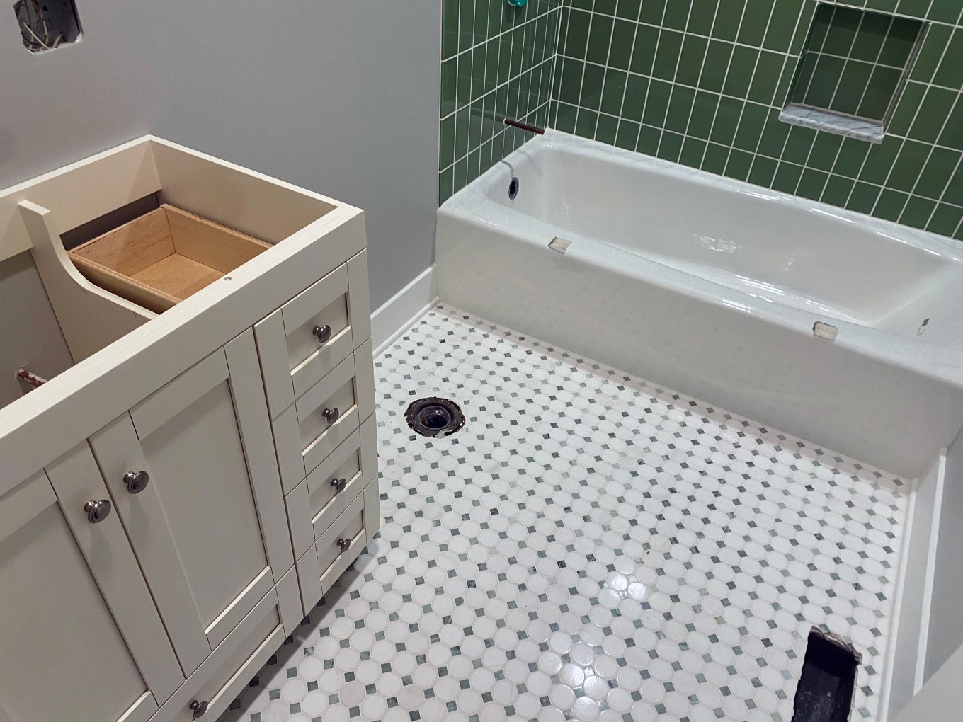 A bathroom in the process of being remodeled that is almost finished.