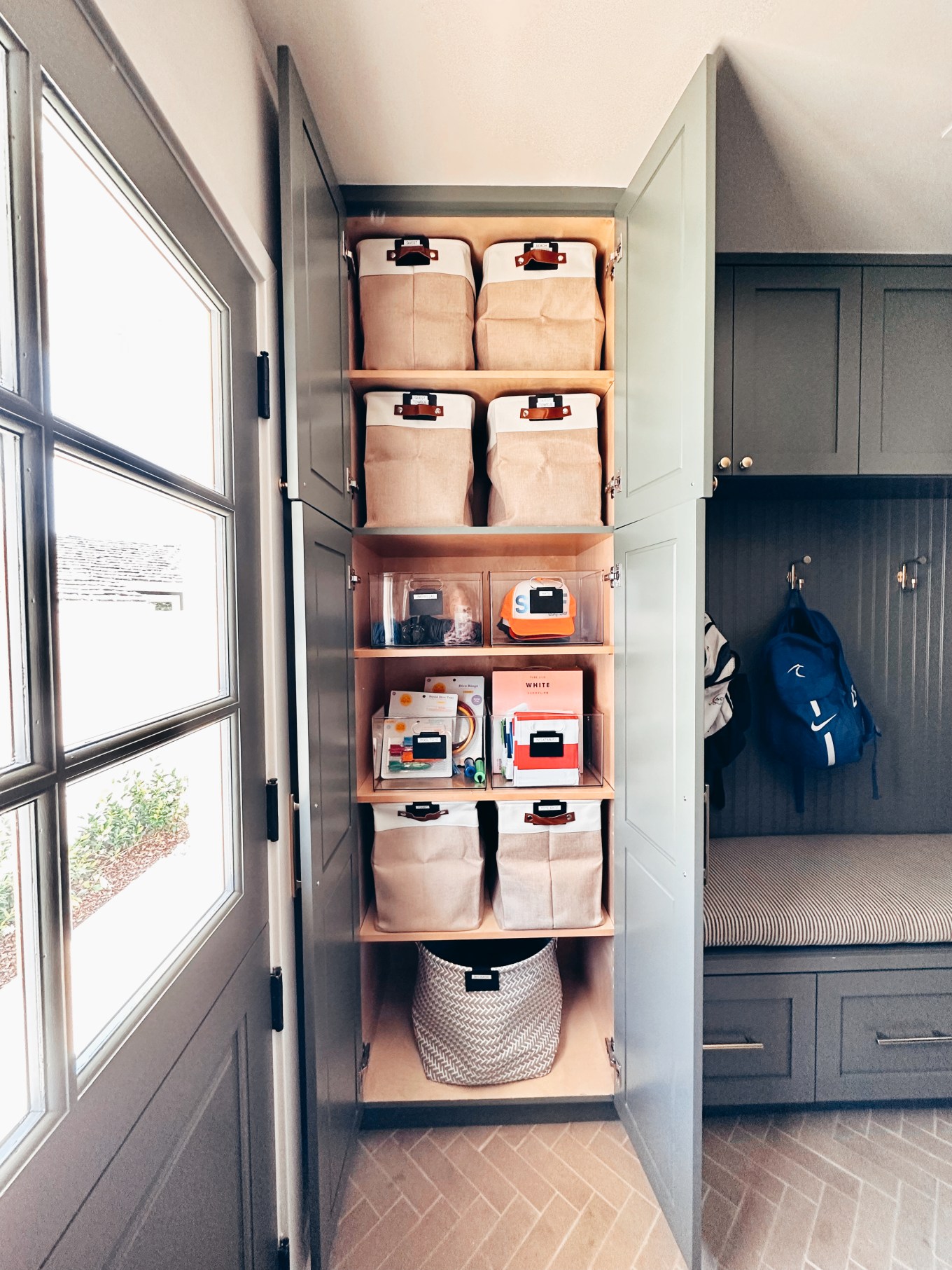 A Closet full of storage bins for sports equipment