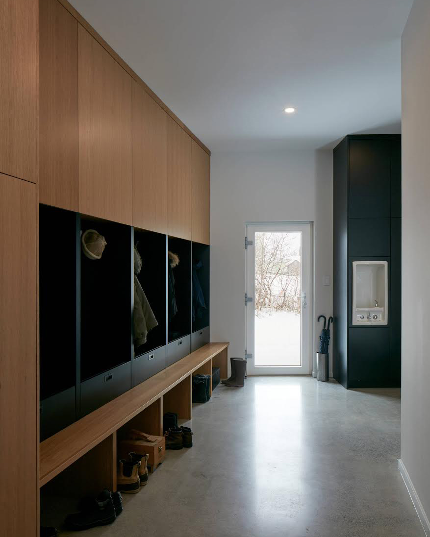 An organized mudroom in a modern home.