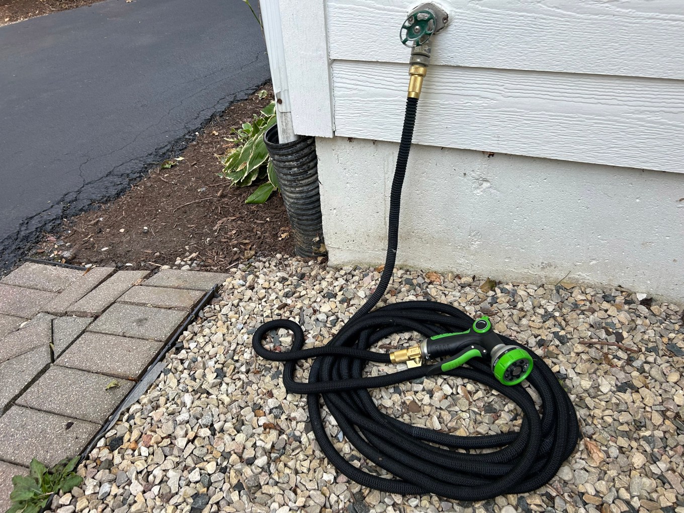 A drain hose on the side of the house -the kind you want to disconnect before weather gets too cold.