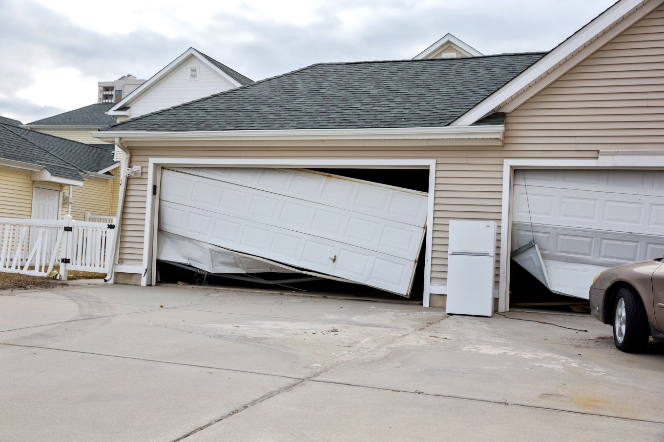 A picture of a damaged, broken garage from a hurricane.