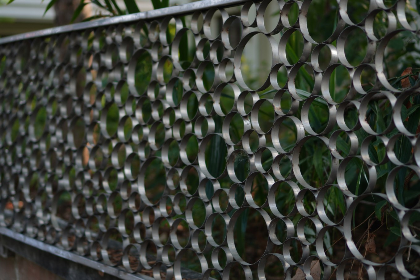 A steel fence with a circle motif. Perfect for a pool fence.