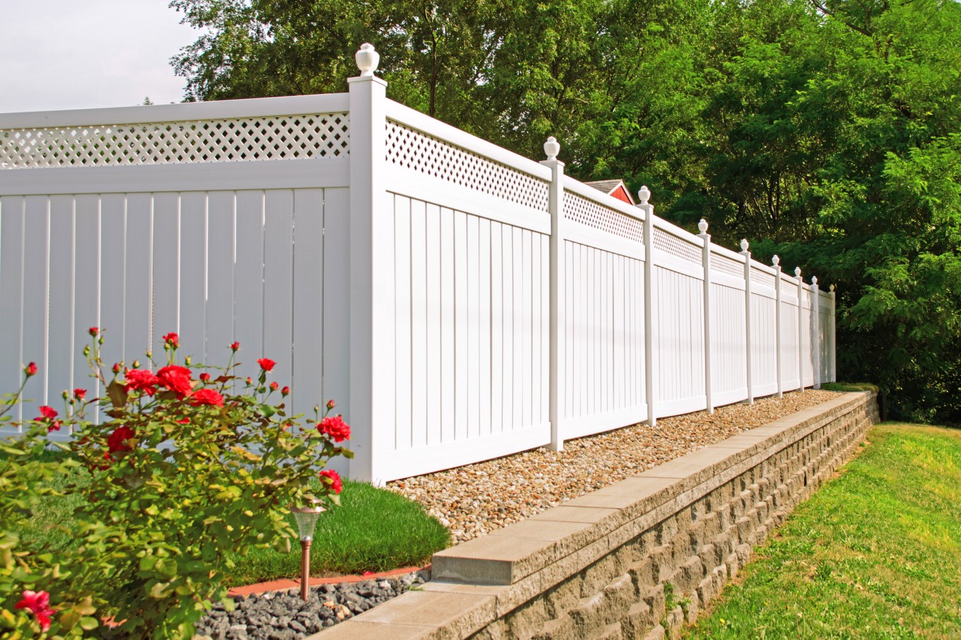 A backyard privacy fence hiding a pool from view.