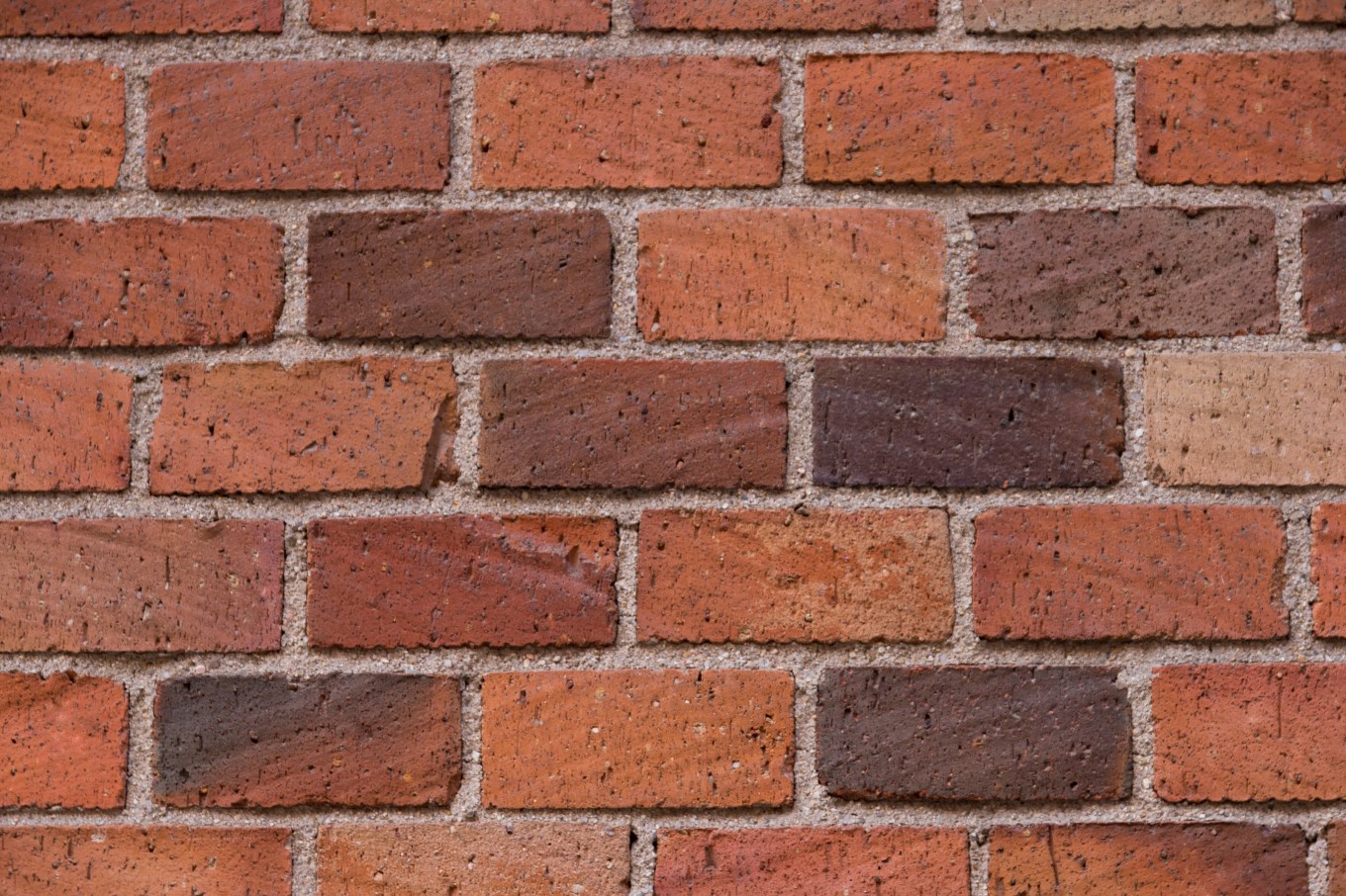 Close up of the texture of brick siding on a house.