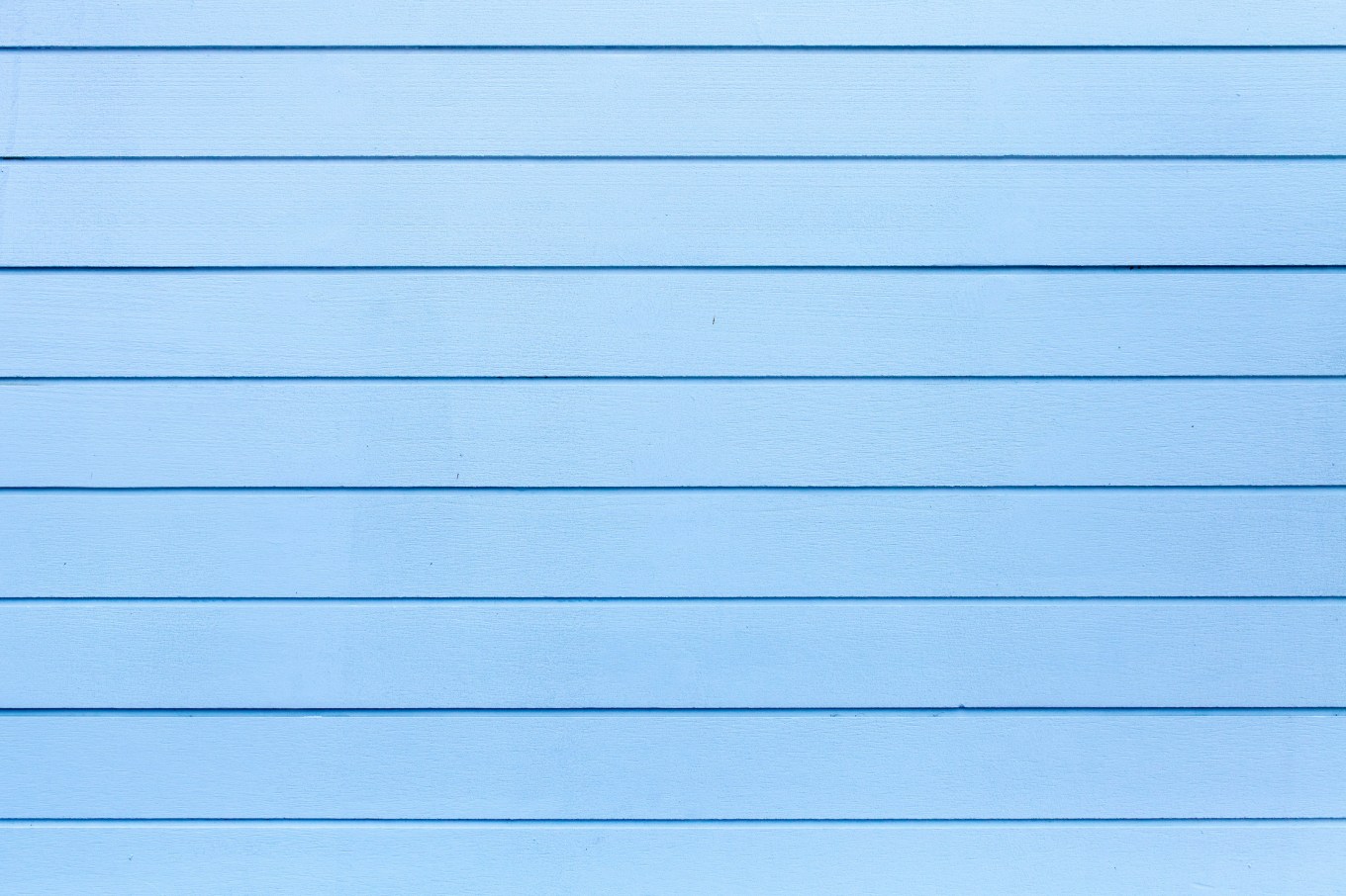 Close up of the texture of wood siding on a house.