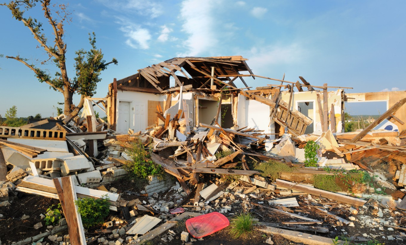 Close up of home destroyed by tornado.